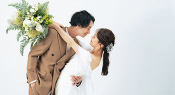 a bride and groom embrace on their wedding day